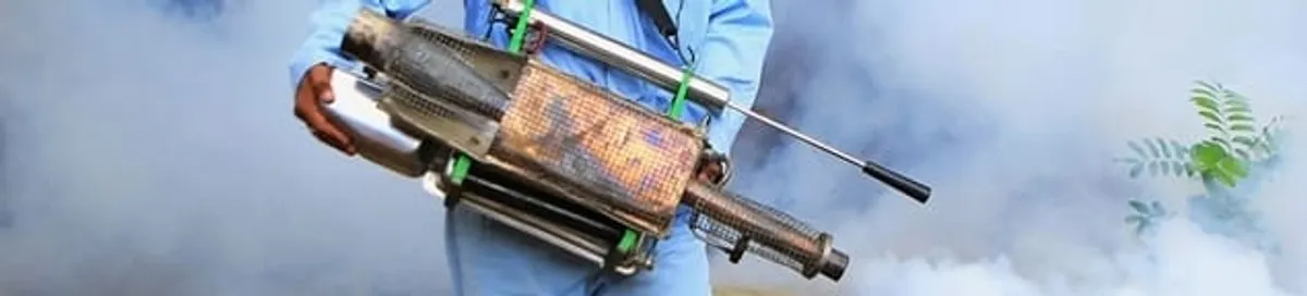 Fumigation technician using a fogger for deep pest treatment in Anchorage, AK